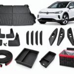 VW ID.4: New Owner Ultimate Pack showing boot liner, mud flaps, door-edge guards, door-handle covers, seal strips, console organizers and folding storage box.